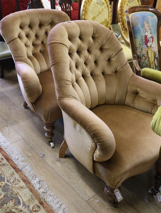 Two Victorian deep-buttoned armchairs on turned legs